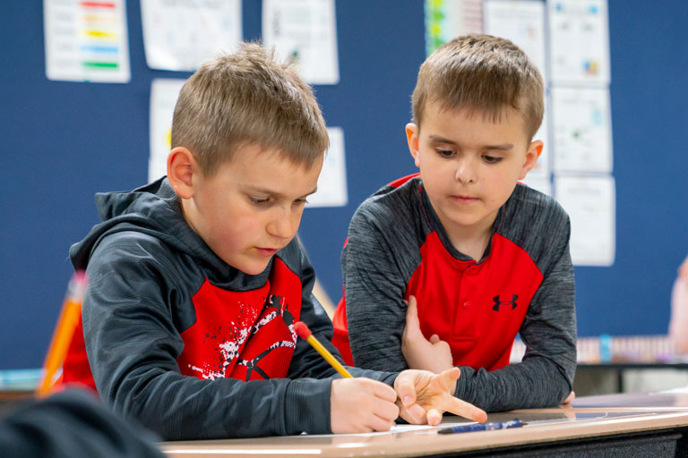 Two students working on math problems together